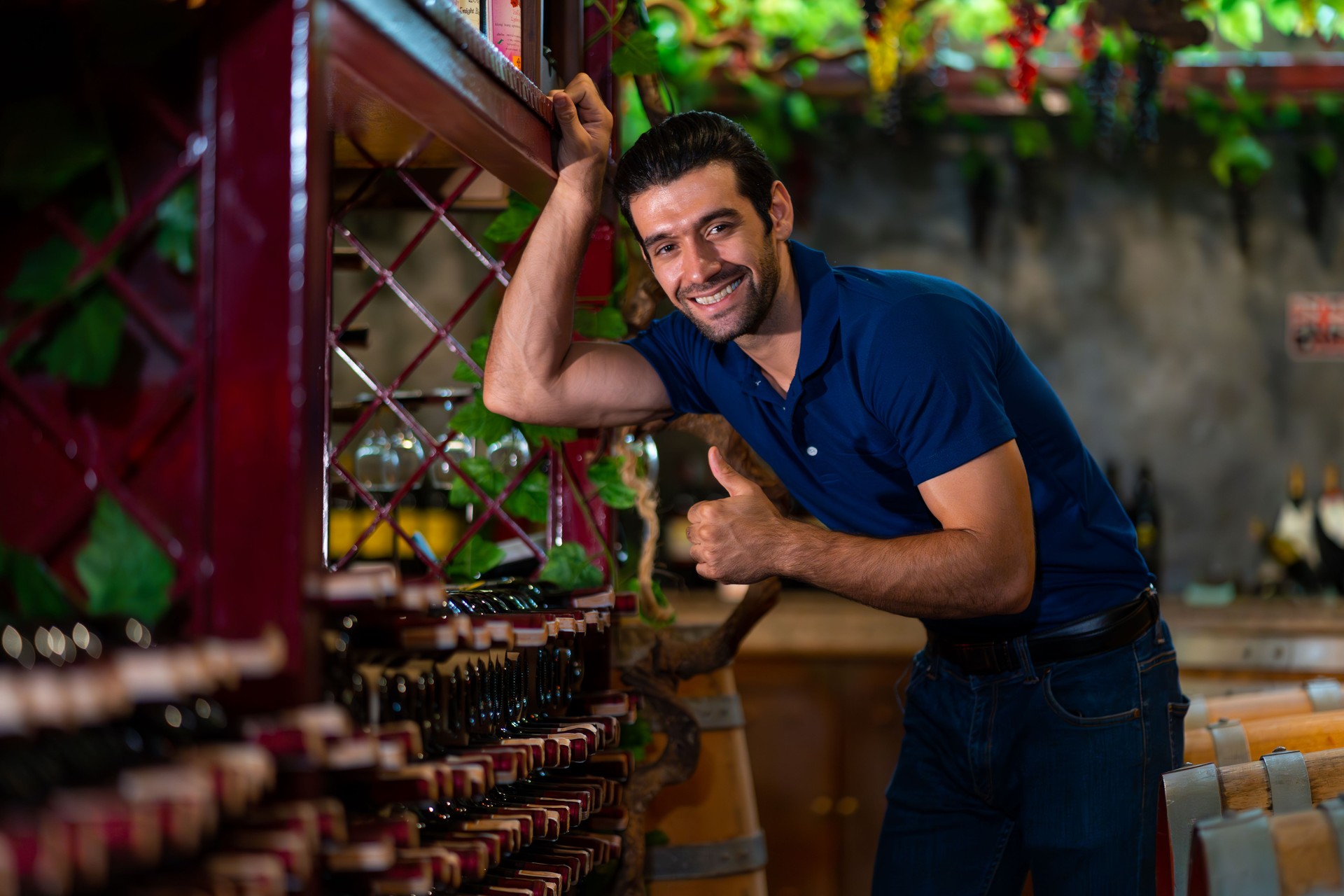 Caucasian man working in liquor shop.